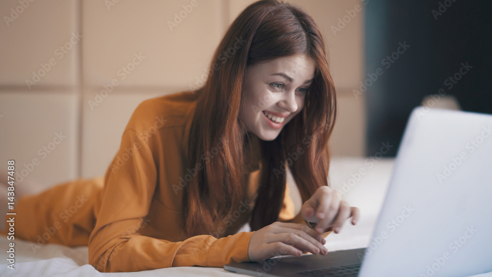 woman looking at laptop, typing on keyboard, correspondence woman looking at laptop, typing on keyboard, correspondence