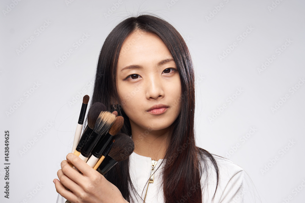 makeup brush, woman with Korean appearance makeup brush, woman with Korean appearance