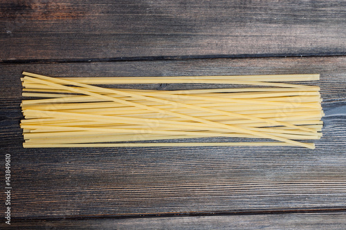 spaghetti sticks wooden background floury product