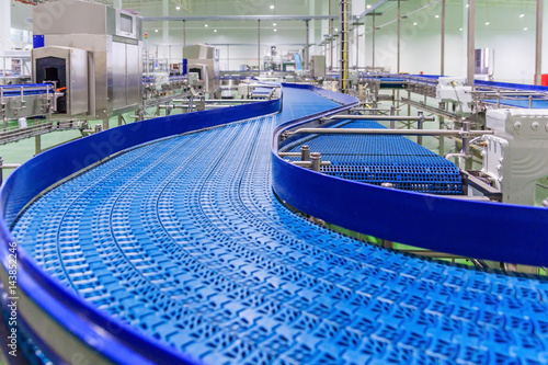Empty conveyor belt of production line, part of industrial equipment photo
