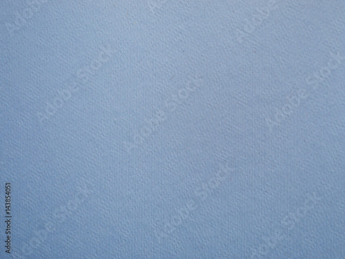 Blue background of textured paper.