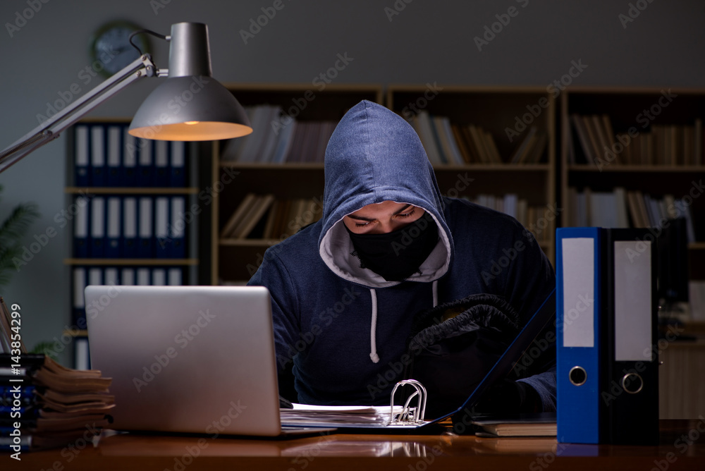 Hacker stealing personal data from home computer Hacker stealing personal data from home computer