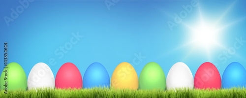 easter eggs behind green grass meadow. easter outdor garden at sunny day. 3d rendering