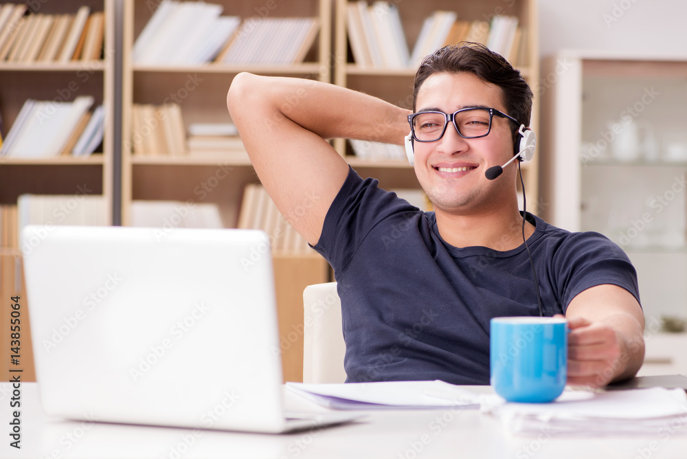 Young student drinking coffee from cup Young student drinking coffee from cup