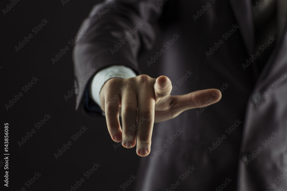 concept of success in business:businessman pointing his finger forward