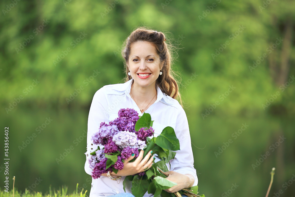 portrait of happy pregnant woman with bouquet of lilacs portrait of happy pregnant woman with bouquet of lilacs