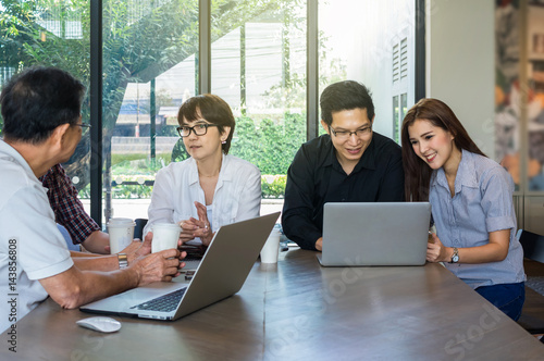 Group of Asian Business People with casual suit are meeting in the modern Office or coffee shop, people group shot concept