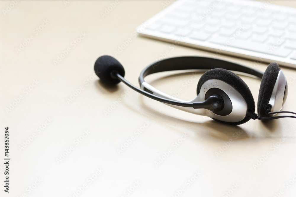 Office desk with headset and keyboard brown background mockup Office desk with headset and keyboard brown background mockup