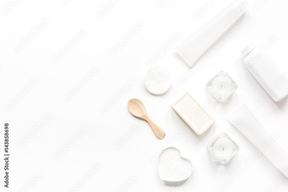 bodycare concept with white set of cosmetics on woman desk top view mock-up bodycare concept with white set of cosmetics on woman desk top view mock-up