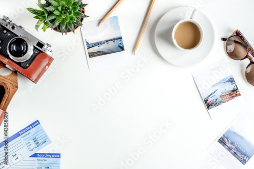 tourist stuff with coffee and photos on white background top view mock-up photo