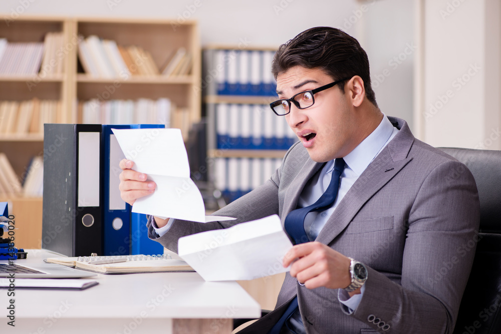 Businessman receiving letter in the office Businessman receiving letter in the office