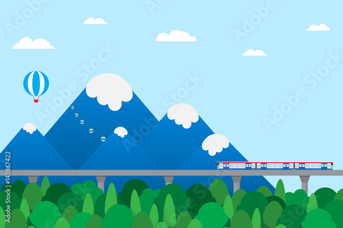 train outbound to countryside with mountain background