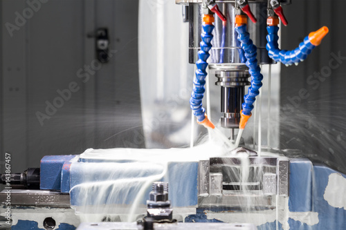 High precision CNC machining center working, operator machining automotive sample part process