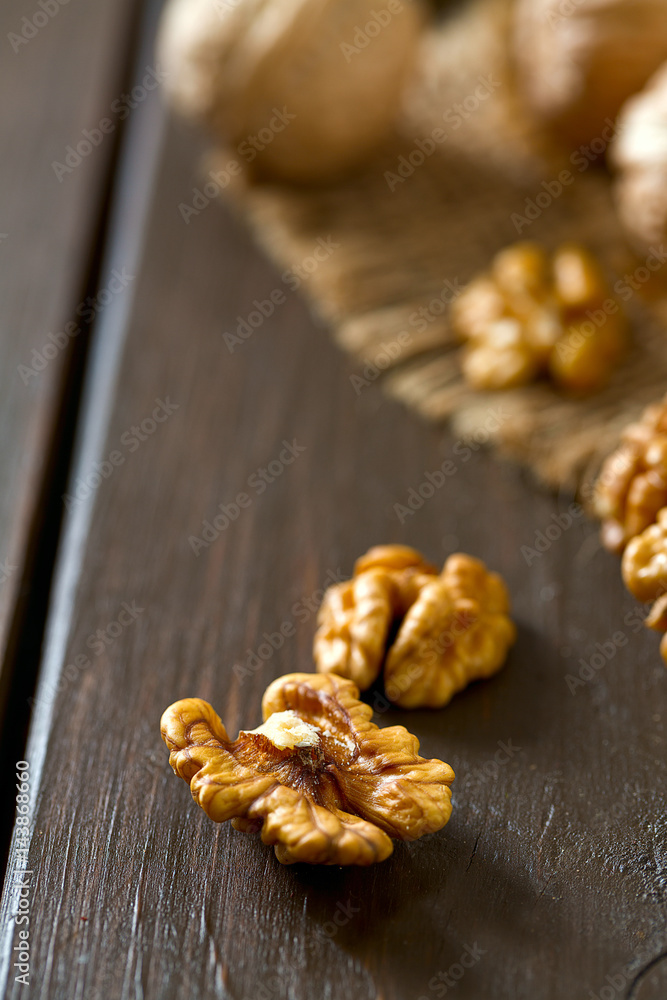 walnuts on wooden surface walnuts on wooden surface