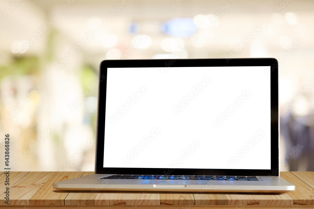 Laptop on wood table in cafe background. For graphics display montage. Laptop on wood table in cafe background. For graphics display montage.