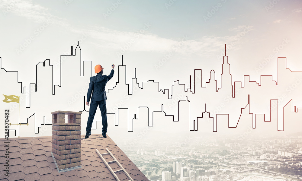 Man architect draw silhouette of modern city on blue sky. Mixed Man architect draw silhouette of modern city on blue sky. Mixed