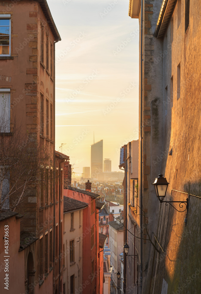 Fototapeta premium View at Part Dieu from a charming, narrow alley in Vieux Lyon, the old town of Lyon.