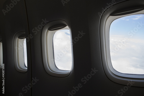 Row of three airplane windows