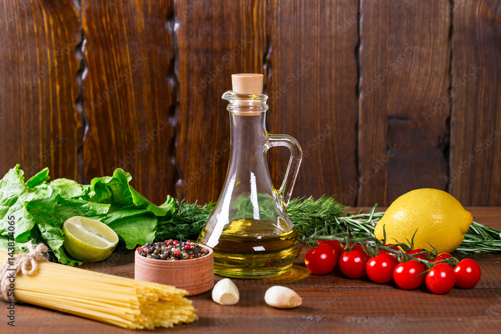 Spaghetti, tomatoes cherry, olive oil, herb and spices on old brown wooden background Spaghetti, tomatoes cherry, olive oil, herb and spices on old brown wooden background