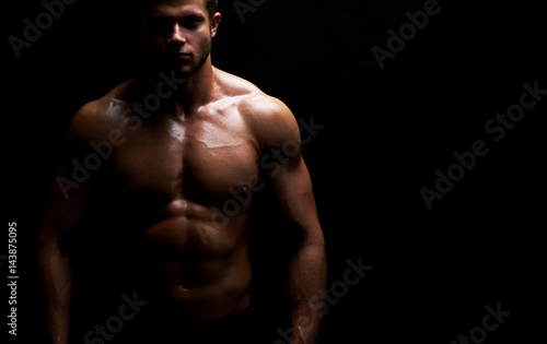 Studio shot of a handsome young sportsman posing shirtless showing off his stunning hot sexy muscular body with perfect six-pack copyspace fitness lifestyle sport motivation determination confidence.