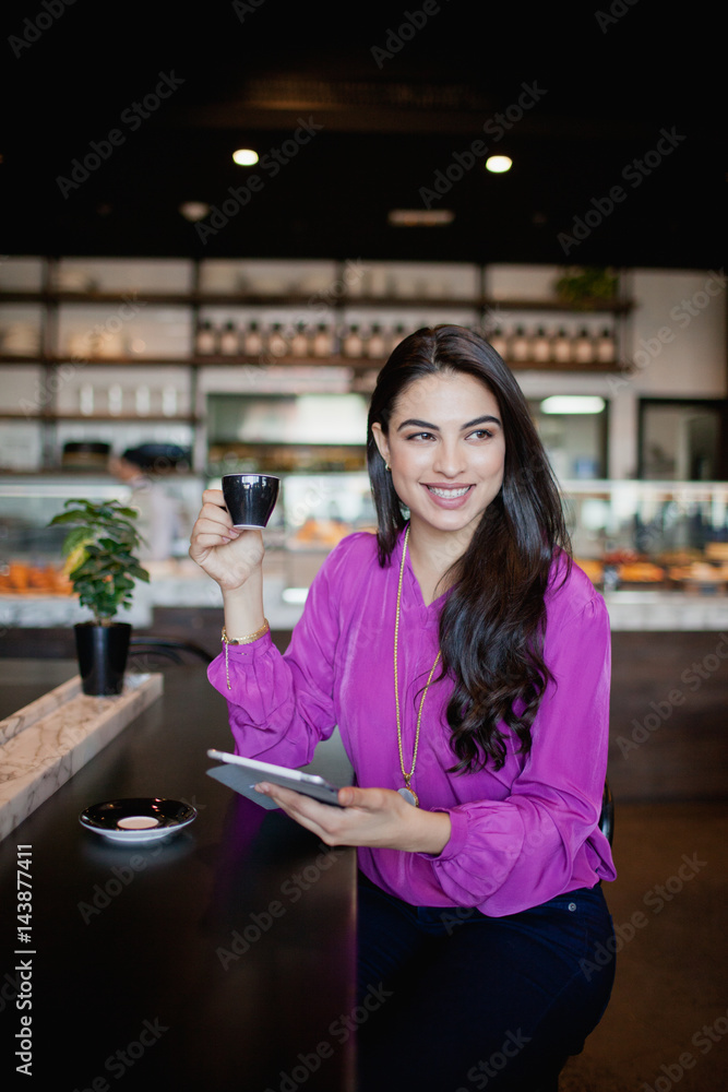 Portrait of woman with digital tablet at cafe. Portrait of woman with digital tablet at cafe.