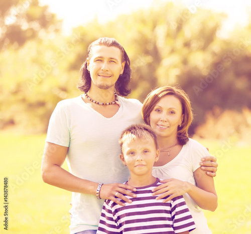 Portrait of adult couple with teenage son