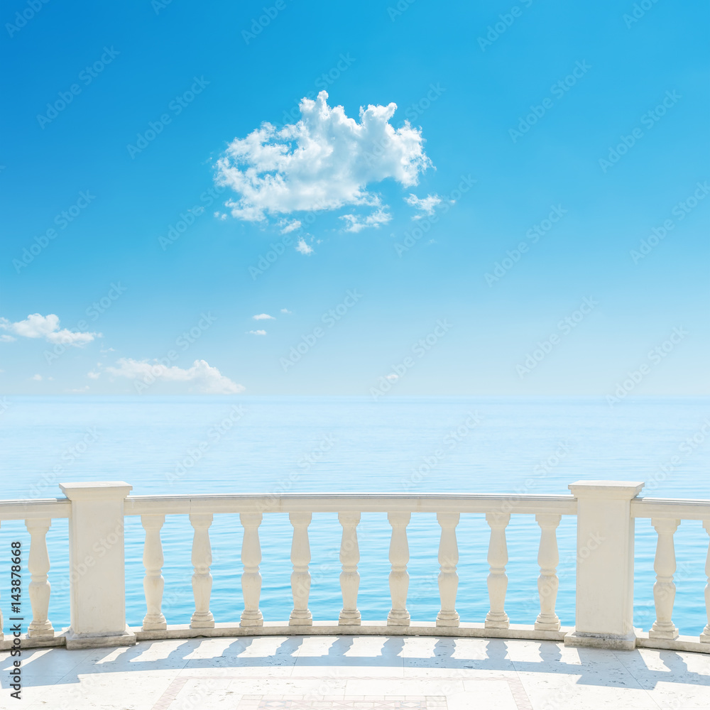 white balcony near sea and blue sky with cloud over it white balcony near sea and blue sky with cloud over it