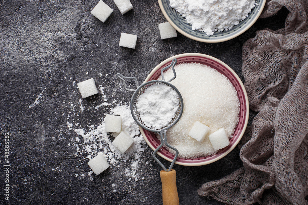 Sugar and powder on concrete background Sugar and powder on concrete background