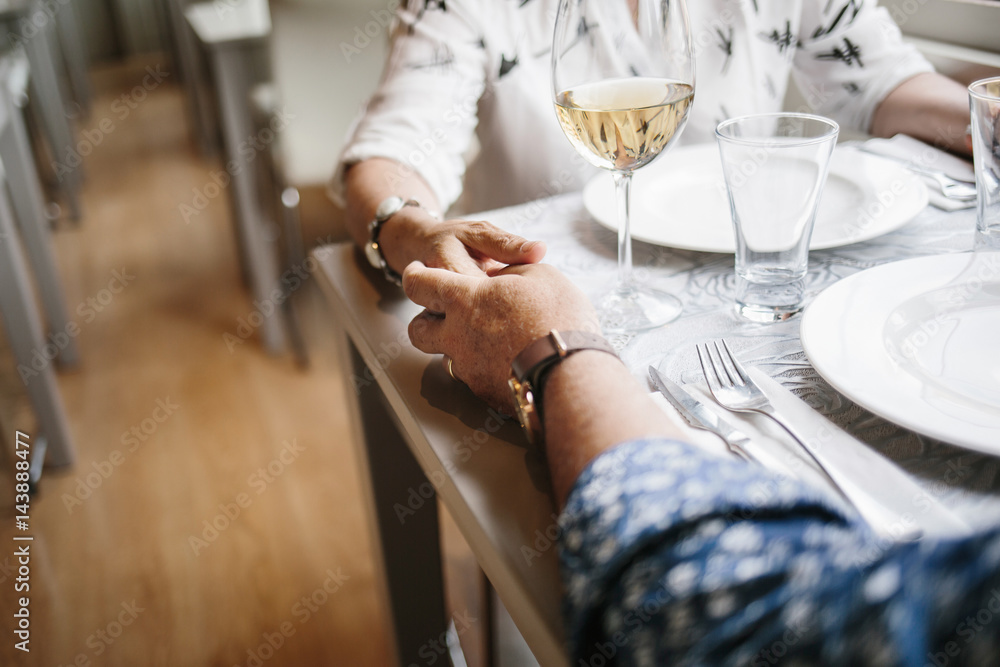 Crop shot of couple holding hands