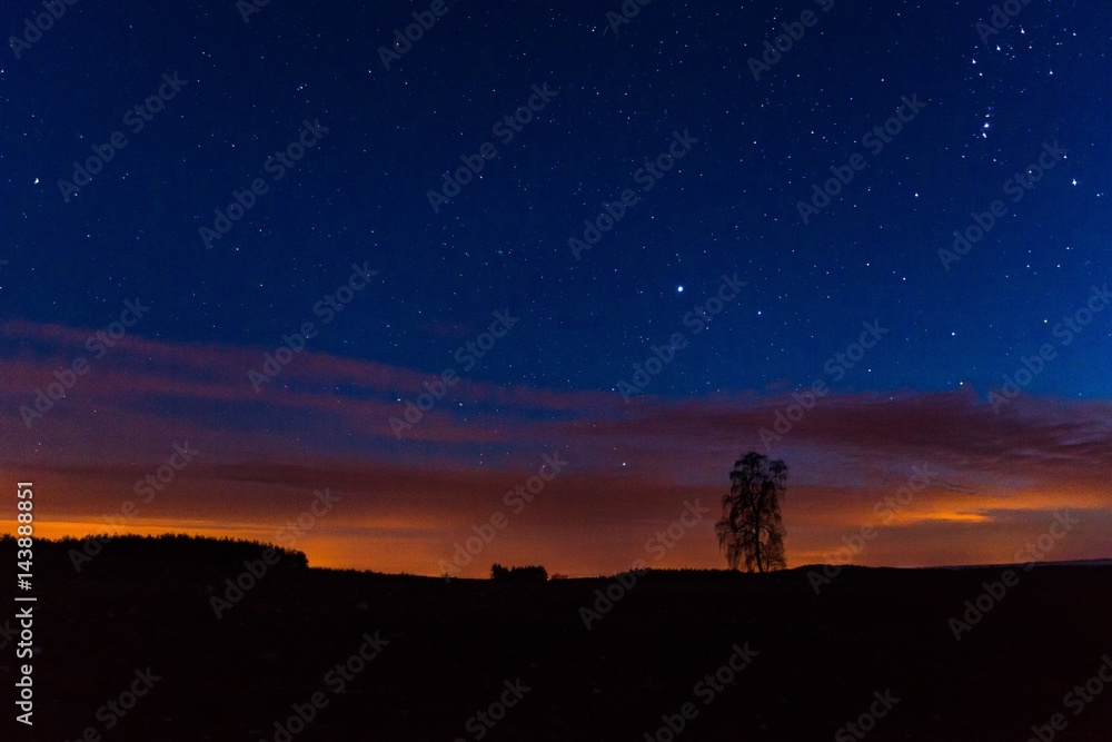 Night sky over rural landscape