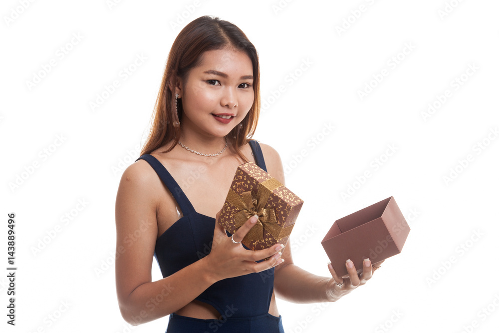 Young Asian woman open a golden gift box. Young Asian woman open a golden gift box.