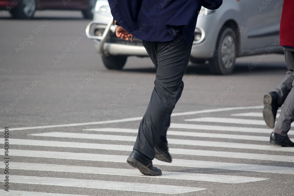 People cross road from zebra crossing People cross road from zebra crossing