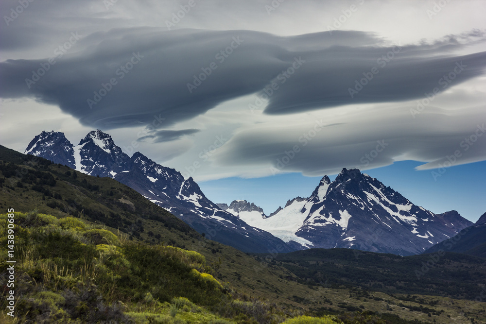 lenticular clouds above snowy mountains in Patagonia