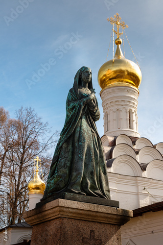 Female statue on cemetery. Necropolis of Donskoy monastery, Moscow, Russia. Moscow. Donskoy Monastery. Don Icon of the Mother of God. Donskoi Monastery. Grand Cathedral Donskaya icon of Divine Mother photo