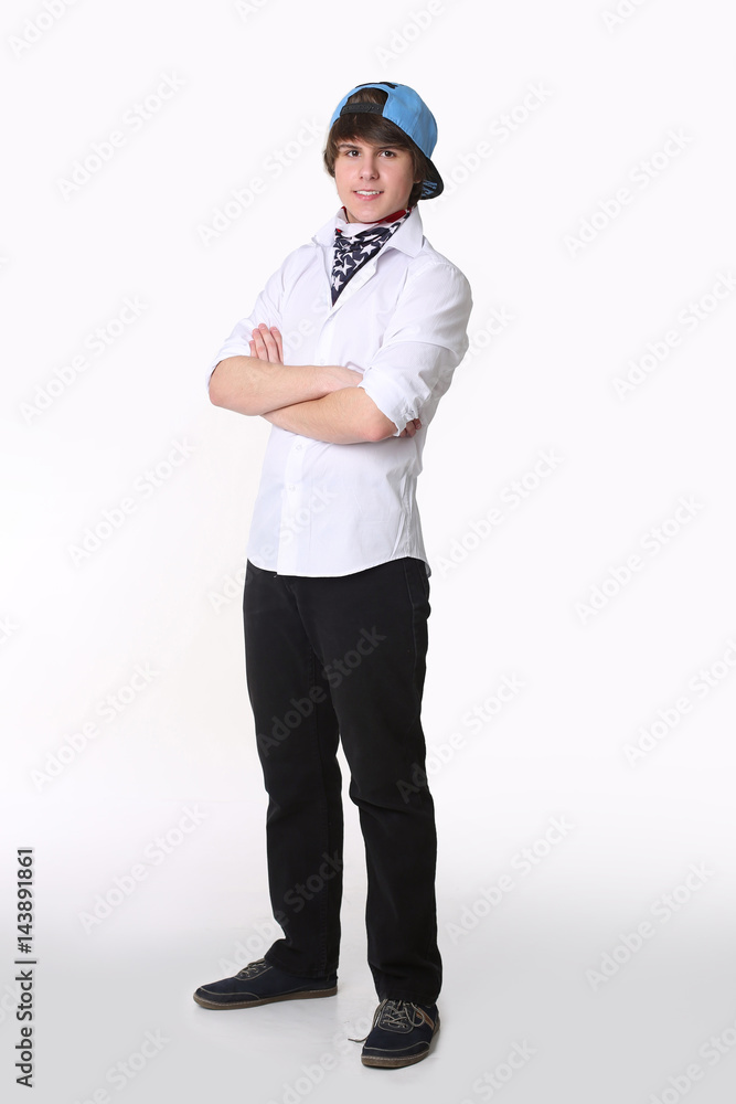 Handsome student confidence. Studio full length portrait of young man in american bandana and cap with hands crossed Isolated on white background. Handsome student confidence. Studio full length portrait of young man in american bandana and cap with hands crossed Isolated on white background.
