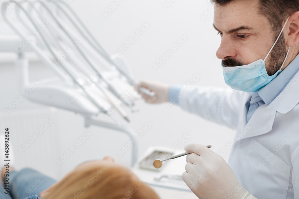 Experienced precise specialist employing tools for manipulation Experienced precise specialist employing tools for manipulation