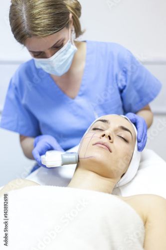 Cosmetic treatments for the skin in the beauty salon. Woman in spa salon