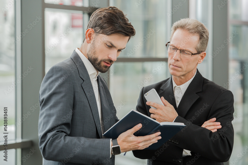 Stylish businessmen working in office Stylish businessmen working in office