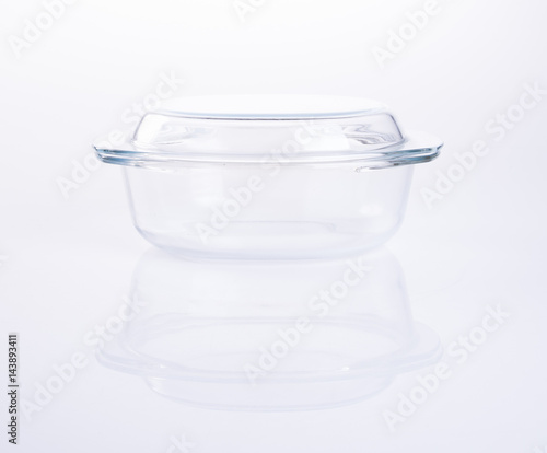 glass pot or glass casserole with lid for baking on a background.