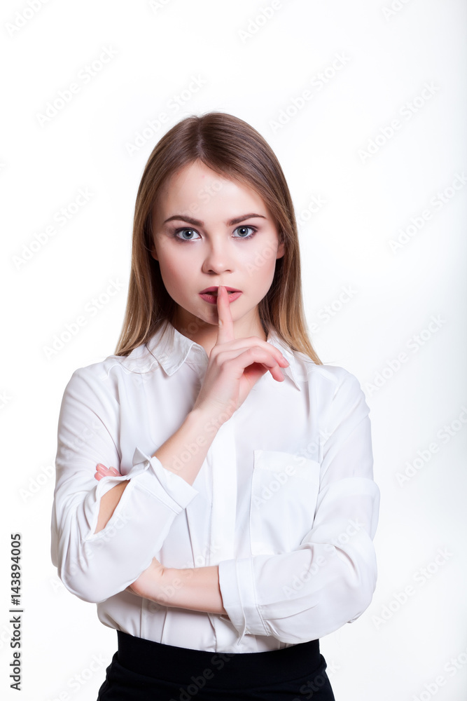 Young attractive business girl on a white background showing signs Young attractive business girl on a white background showing signs