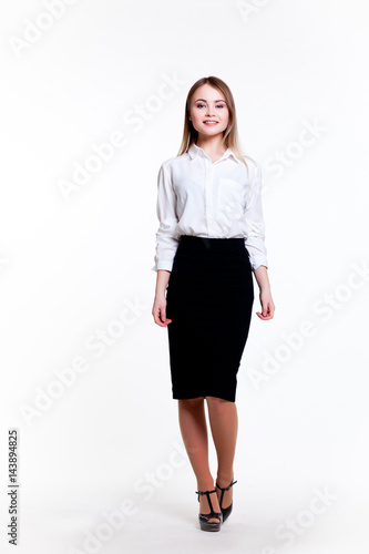 Young attractive business girl on a white background