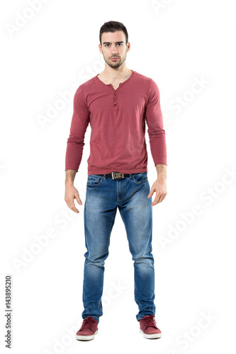 Upset serious trendy casual man with intense stare at camera.  Full body length portrait isolated over white background. 
