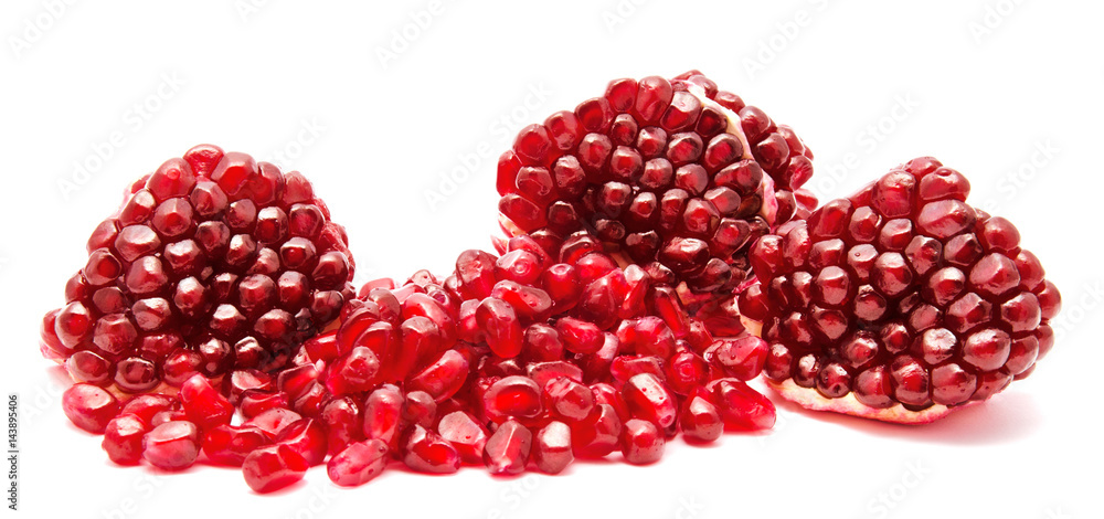 Ripe pomegranate fruit seeds isolated on a white Ripe pomegranate fruit seeds isolated on a white