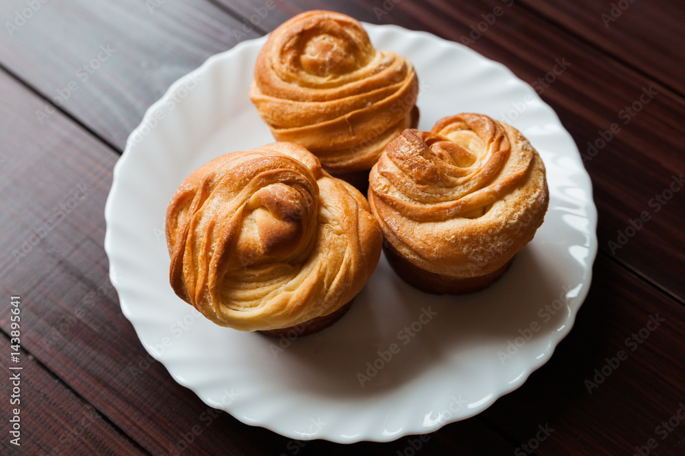 Fresh bread rolls on a white plate Fresh bread rolls on a white plate
