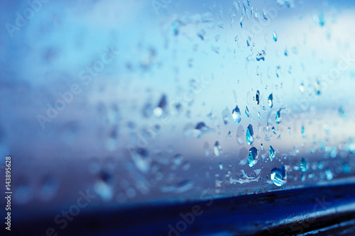 Vászonkép Textures of water droplets of rain flow down the windowpane