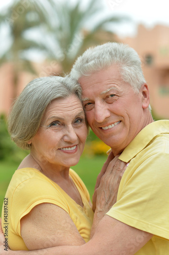 Happy elderly couple embracing