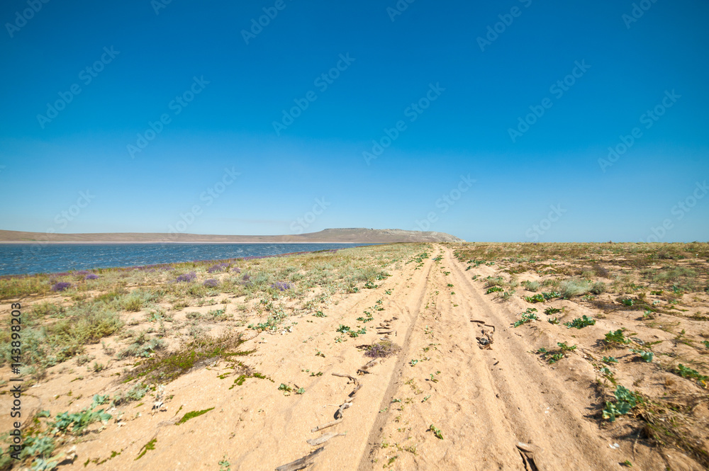 Road to red salt lake in Crimea, Russia Road to red salt lake in Crimea, Russia