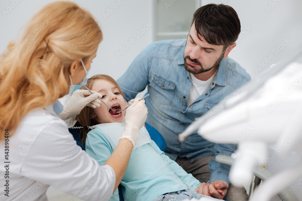 Loving dad taking her daughter to a doctor Loving dad taking her daughter to a doctor