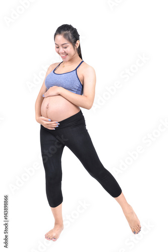 Pregnant women workouting for baby health. © PeterO