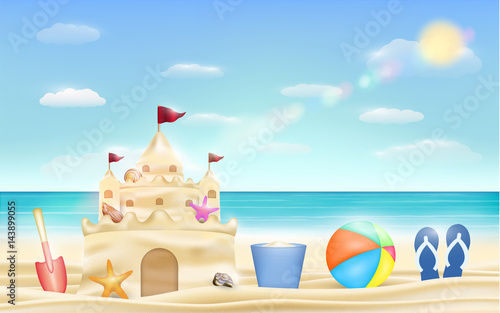 sand castle and shovel bucket and ball on a sea beach